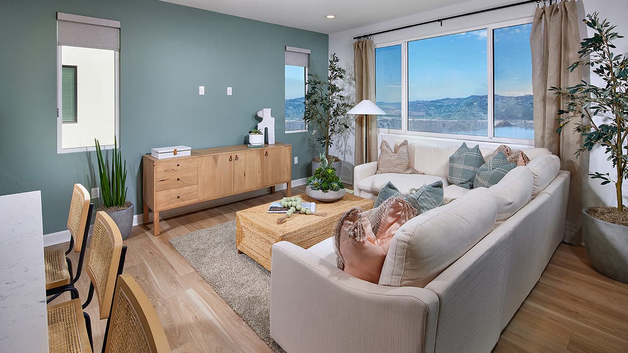 Living room sectional with view of lake and mountains